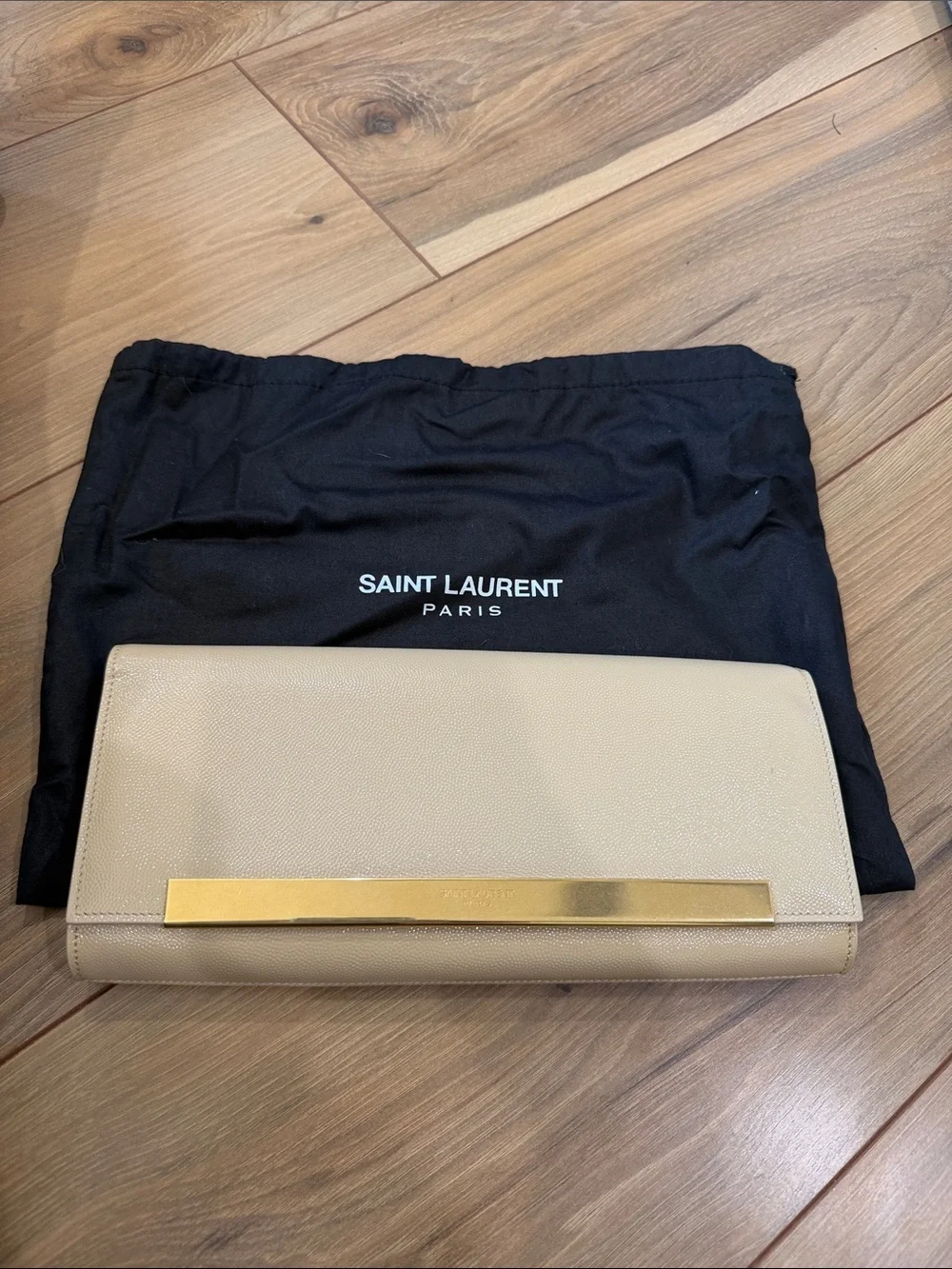 Saint Laurent Beige Leather Clutch with Gold Bar Accent